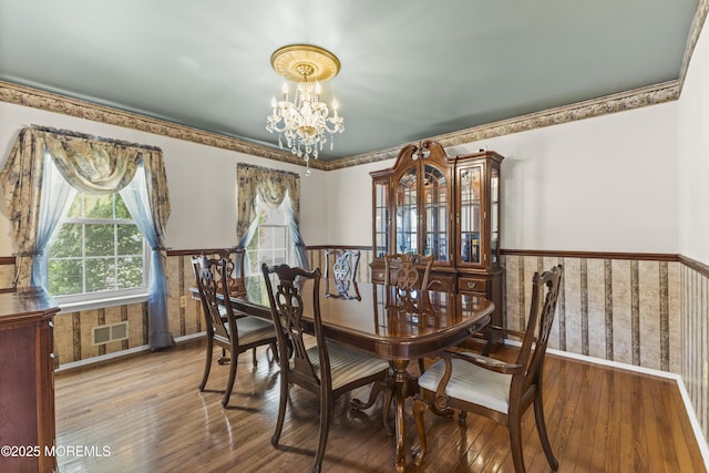 22 Enclosure Dr, Morganville, NJ 07751 - dining area with a chandelier, wainscoting, and wood-type flooring