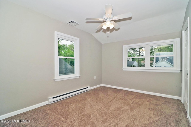 503 Center St, Forked River, NJ 08731 - carpeted empty room featuring a baseboard heating unit, plenty of natural light, vaulted ceiling, a ceiling fan, and baseboards