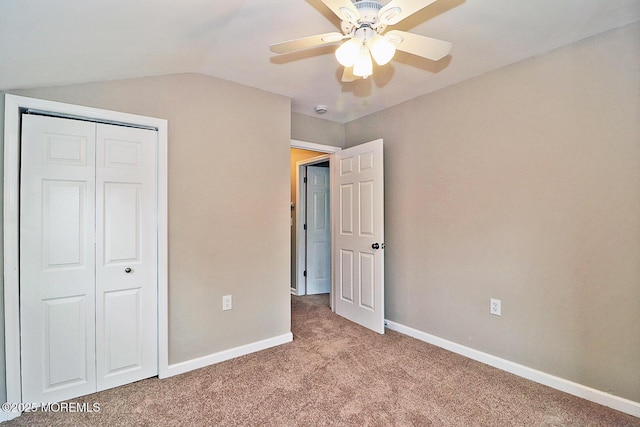 503 Center St, Forked River, NJ 08731 - unfurnished bedroom featuring carpet flooring, a closet, baseboards, vaulted ceiling, and ceiling fan