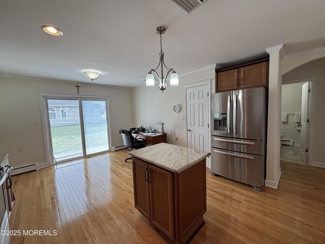 2 Corinth Pl, Toms River, NJ 08757 - kitchen featuring stainless steel fridge, arched walkways, ornamental molding, light wood-type flooring, and light countertops