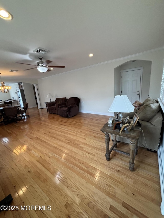 2 Corinth Pl, Toms River, NJ 08757 - living area featuring crown molding, a ceiling fan, light wood-type flooring, a chandelier, and baseboards