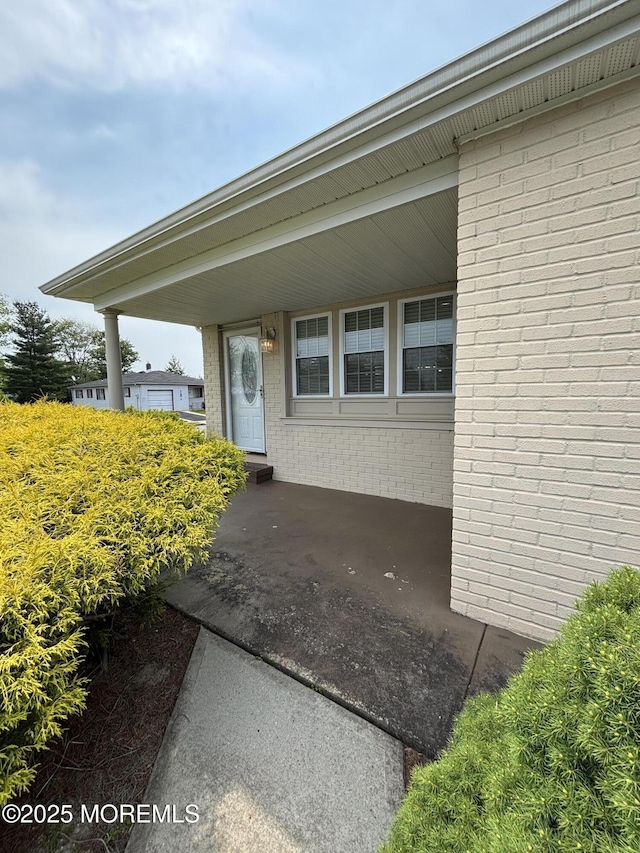 2 Corinth Pl, Toms River, NJ 08757 - doorway to property featuring brick siding