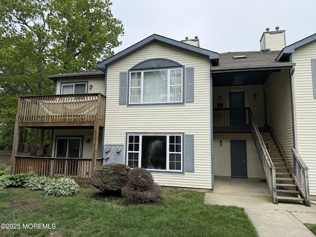 87 Puffin Glade, Berkeley, NJ 08721 - back of property with stairway, a chimney, and a yard