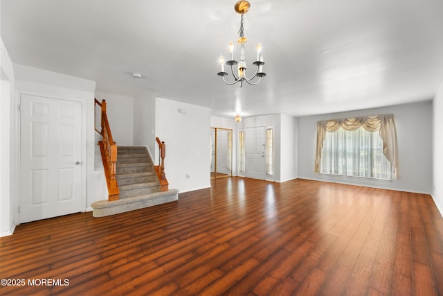 238 Larchwood Ct, Howell, NJ 07731 - unfurnished living room with a chandelier, stairs, wood finished floors, and baseboards