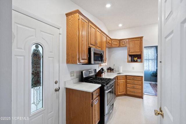 5 E Jack St, Hazlet, NJ 07730 - kitchen featuring appliances with stainless steel finishes, light countertops, brown cabinets, a sink, and recessed lighting