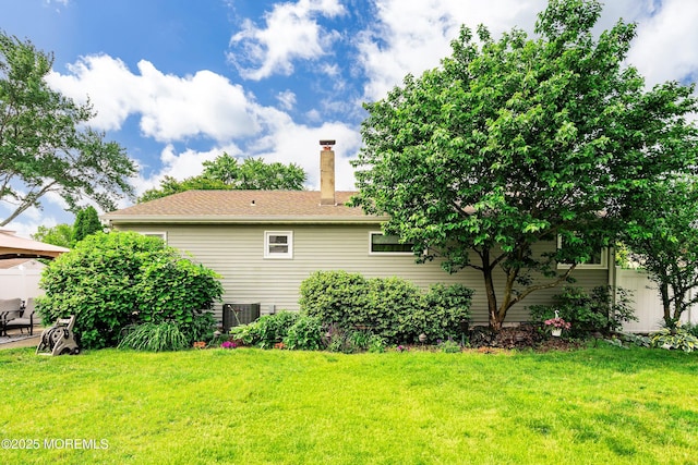 5 E Jack St, Hazlet, NJ 07730 - back of property with a yard, a chimney, and central AC