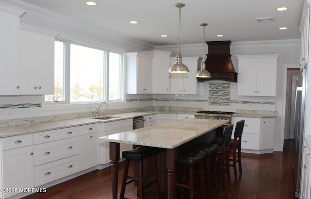 443 Driveway, Oceanport, NJ 07757 - kitchen with a sink, custom exhaust hood, a breakfast bar area, white cabinets, and ornamental molding