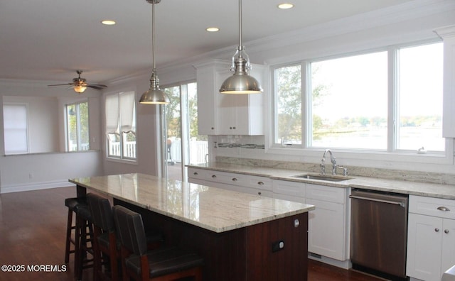 443 Driveway, Oceanport, NJ 07757 - kitchen with dishwasher, a sink, a kitchen island, white cabinets, and a breakfast bar area