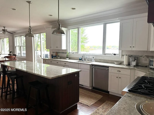 443 Driveway, Oceanport, NJ 07757 - kitchen featuring stainless steel dishwasher, a sink, crown molding, a kitchen island, and light stone countertops