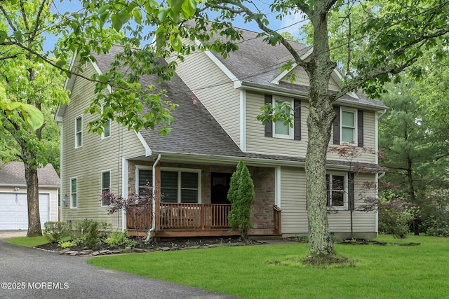 137 Willow Dr, Jackson, NJ 08527 - view of front of home with covered porch, roof with shingles, a front yard, and a garage