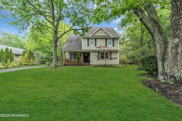 137 Willow Dr, Jackson, NJ 08527 - view of front of house with a front yard, covered porch, and roof with shingles