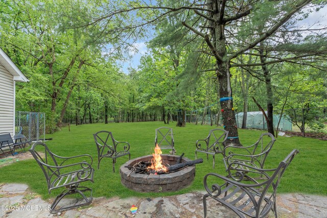 137 Willow Dr, Jackson, NJ 08527 - view of grassy yard with an outdoor fire pit