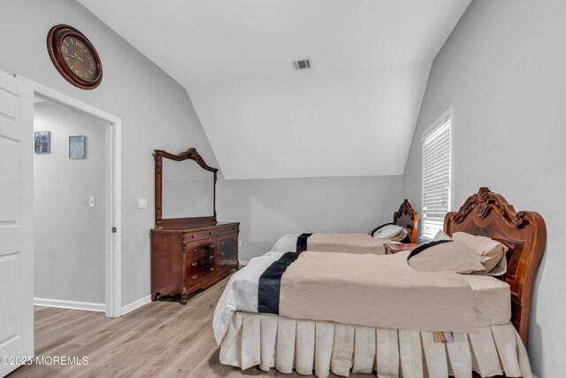 137 Willow Dr, Jackson, NJ 08527 - bedroom with vaulted ceiling, wood finished floors, and baseboards