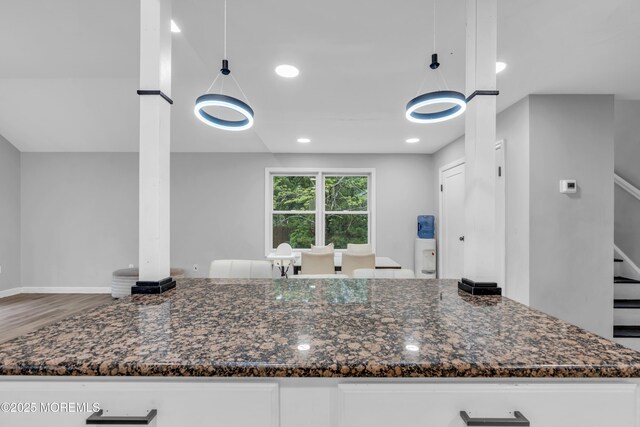 137 Willow Dr, Jackson, NJ 08527 - kitchen with white cabinets, dark stone countertops, wood finished floors, hanging light fixtures, and recessed lighting
