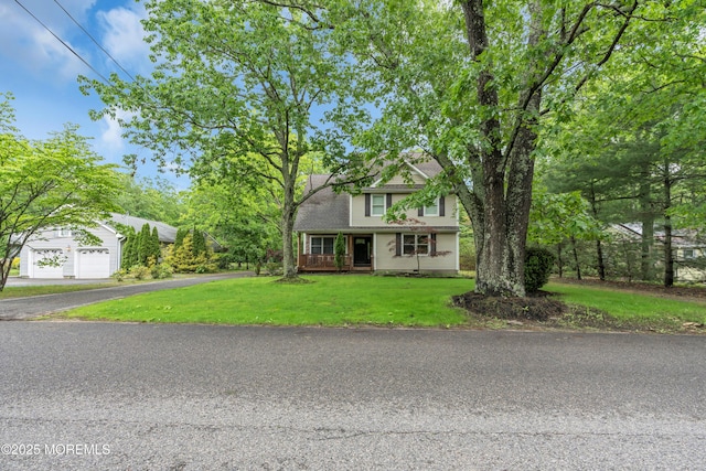 137 Willow Dr, Jackson, NJ 08527 - view of front facade with a front lawn, driveway, covered porch, and a garage