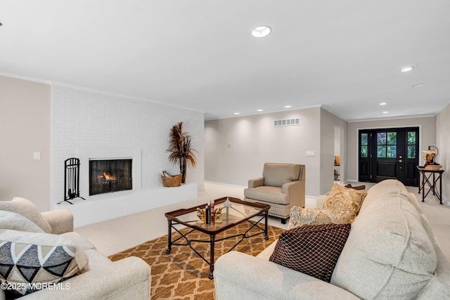 2627 Ramshorn Dr, Manasquan, NJ 08736 - living room with crown molding, recessed lighting, and a fireplace