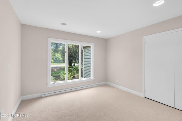 2627 Ramshorn Dr, Manasquan, NJ 08736 - carpeted empty room with baseboard heating and recessed lighting
