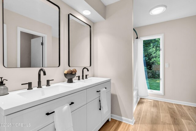 2627 Ramshorn Dr, Manasquan, NJ 08736 - full bathroom featuring double vanity and wood finished floors