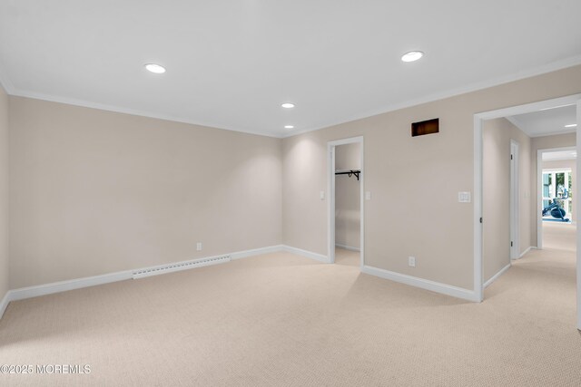 2627 Ramshorn Dr, Manasquan, NJ 08736 - unfurnished bedroom with ornamental molding, light colored carpet, recessed lighting, a spacious closet, and a baseboard heating unit