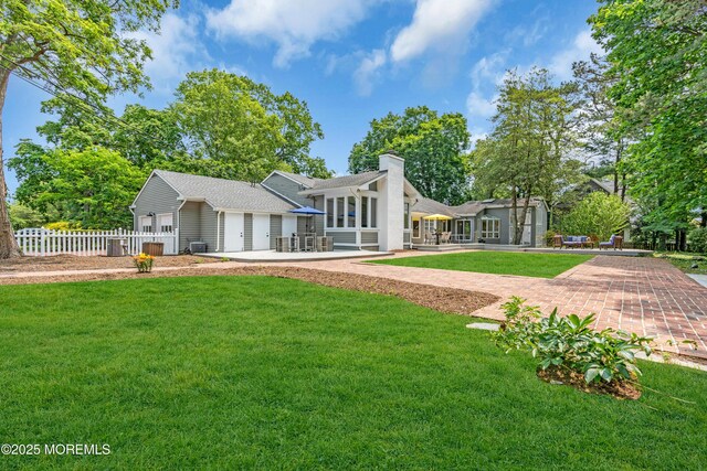 2627 Ramshorn Dr, Manasquan, NJ 08736 - rear view of property with a chimney and a garage