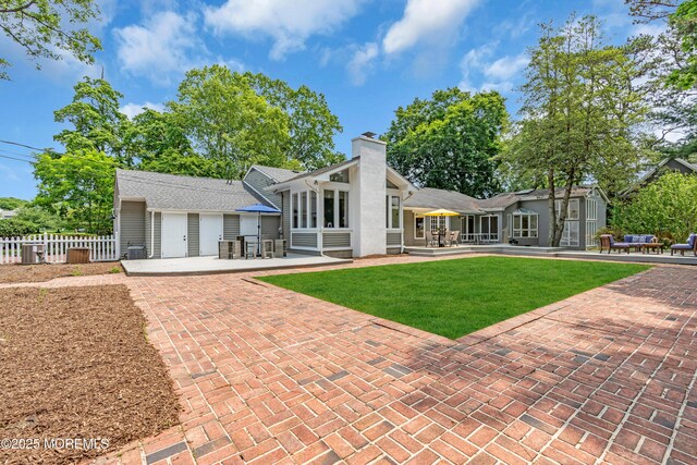 2627 Ramshorn Dr, Manasquan, NJ 08736 - rear view of property with a patio area and a chimney