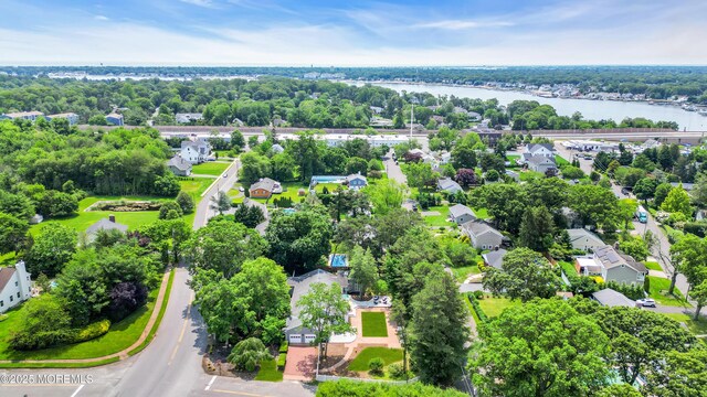 2627 Ramshorn Dr, Manasquan, NJ 08736 - aerial view of residential area with a large body of water and a tree filled landscape
