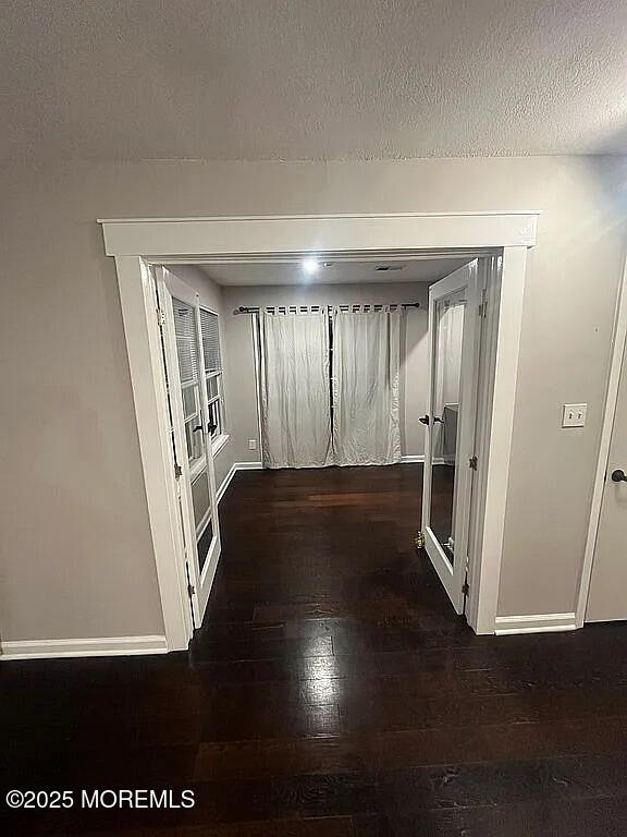 167 Frontier Way, Tinton Falls, NJ 07753 - hall with wood-type flooring, baseboards, and a textured ceiling