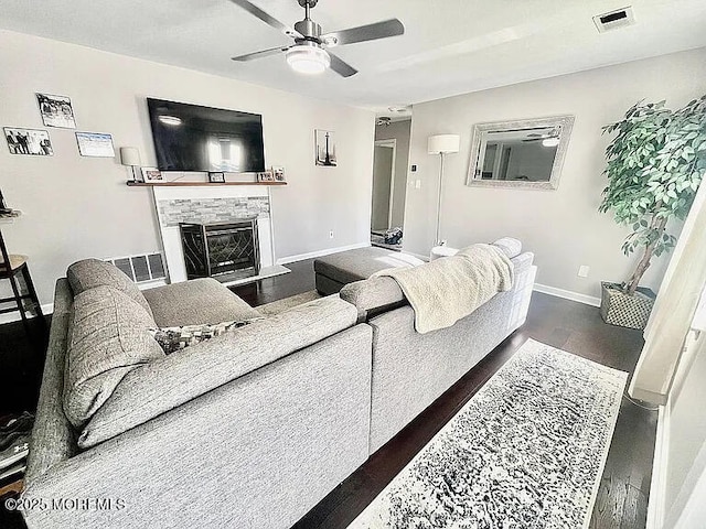 167 Frontier Way, Tinton Falls, NJ 07753 - living area featuring a glass covered fireplace, ceiling fan, baseboards, and wood finished floors