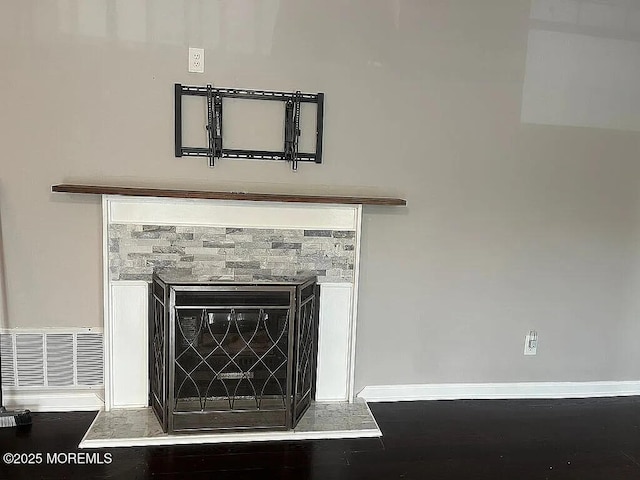 167 Frontier Way, Tinton Falls, NJ 07753 - detailed view of baseboards, wood finished floors, and a glass covered fireplace