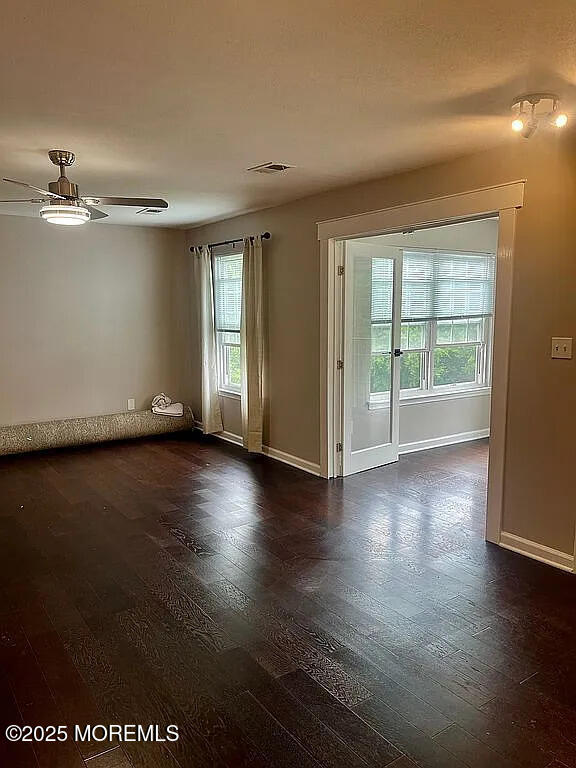 167 Frontier Way, Tinton Falls, NJ 07753 - unfurnished room featuring a ceiling fan, dark wood finished floors, and baseboards