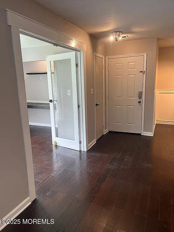 167 Frontier Way, Tinton Falls, NJ 07753 - entrance foyer with dark wood finished floors and baseboards