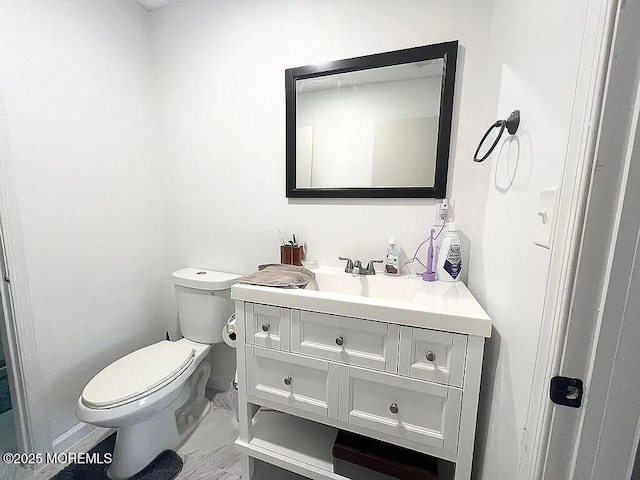 167 Frontier Way, Tinton Falls, NJ 07753 - half bath with vanity, marble look tile flooring, toilet, and baseboards