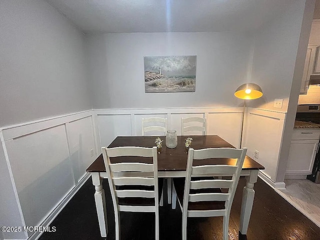 167 Frontier Way, Tinton Falls, NJ 07753 - dining area featuring a decorative wall, wood finished floors, and wainscoting