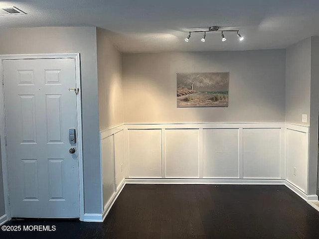 167 Frontier Way, Tinton Falls, NJ 07753 - corridor featuring a decorative wall, dark wood finished floors, and wainscoting