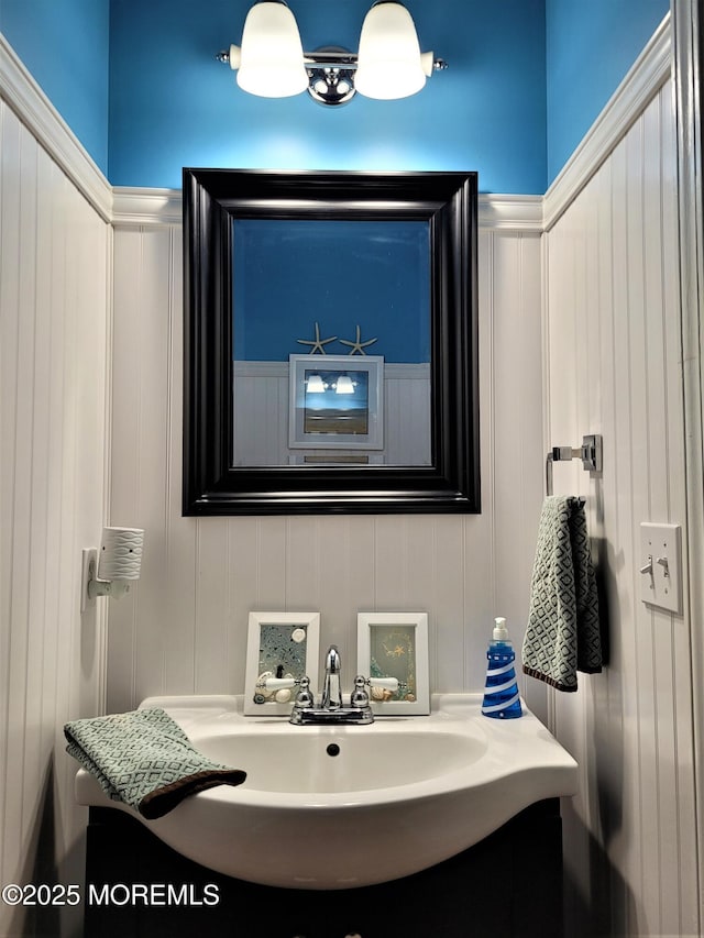63 Briarwood Dr, Little Egg Harbor, NJ 08087 - bathroom with a decorative wall, vanity, and wainscoting