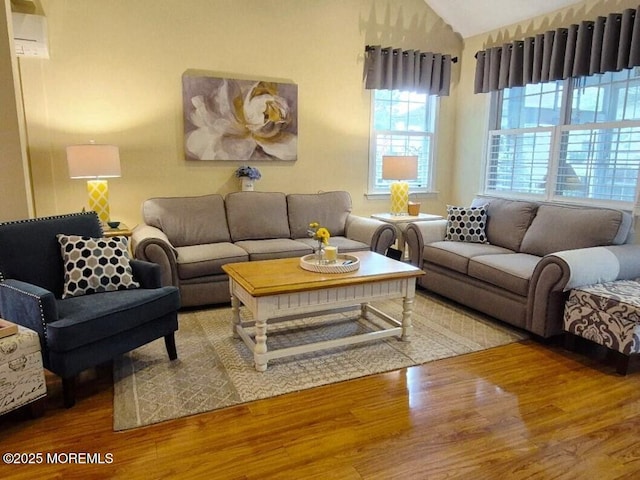 63 Briarwood Dr, Little Egg Harbor, NJ 08087 - living area featuring lofted ceiling, wood finished floors, and an AC wall unit