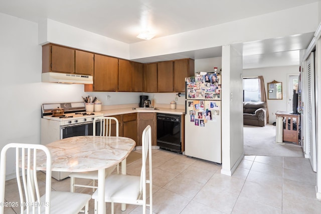 27 Sawmill Rd, Brick, NJ 08724 - kitchen with white appliances, under cabinet range hood, brown cabinetry, and light countertops