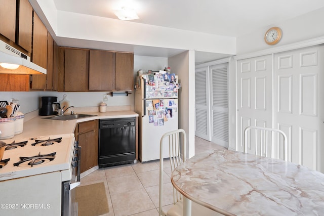 27 Sawmill Rd, Brick, NJ 08724 - kitchen featuring white appliances, brown cabinetry, a sink, light countertops, and light tile patterned floors