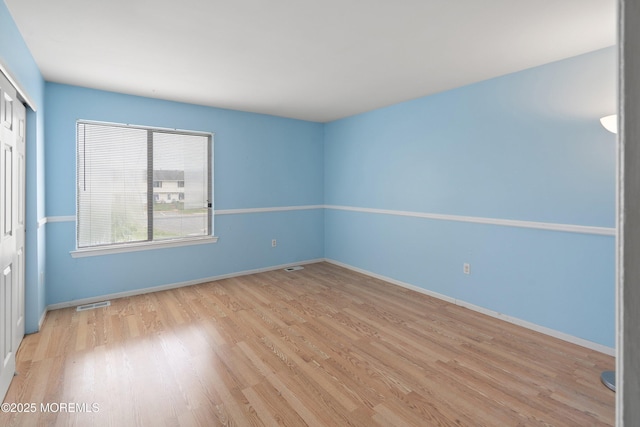 27 Sawmill Rd, Brick, NJ 08724 - unfurnished bedroom featuring a closet, light wood-style floors, and baseboards