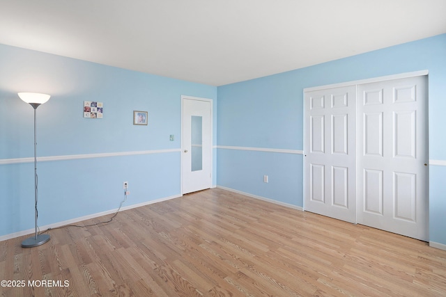 27 Sawmill Rd, Brick, NJ 08724 - unfurnished bedroom with light wood-style floors, baseboards, and a closet
