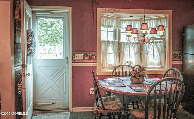 243 Main St, Port Monmouth, NJ 07758 - dining area with a chandelier, plenty of natural light, and baseboards