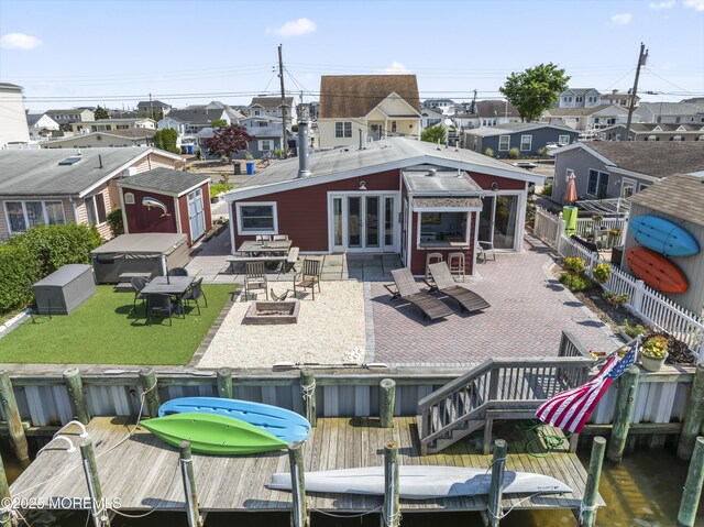 68 Gregg Dr, Beach Haven West, NJ 08050 - back of house featuring a residential view, a patio, and outdoor dining area