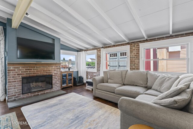 68 Gregg Dr, Beach Haven West, NJ 08050 - living area featuring dark wood-style flooring, a fireplace, and brick wall