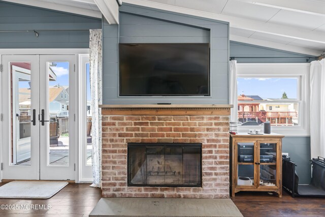 68 Gregg Dr, Beach Haven West, NJ 08050 - living room featuring dark wood-style floors, a brick fireplace, and french doors