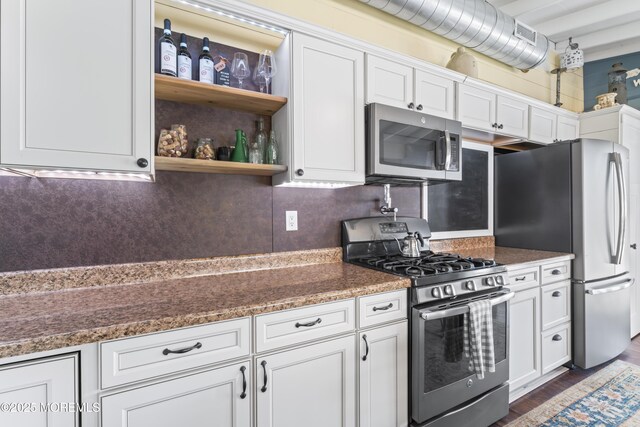 68 Gregg Dr, Beach Haven West, NJ 08050 - kitchen featuring appliances with stainless steel finishes, white cabinetry, open shelves, dark wood-type flooring, and decorative backsplash