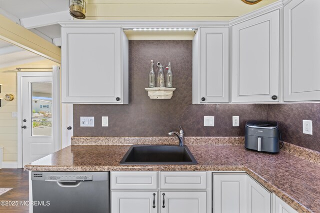 68 Gregg Dr, Beach Haven West, NJ 08050 - kitchen featuring dishwasher, a sink, white cabinets, and beamed ceiling