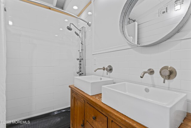 68 Gregg Dr, Beach Haven West, NJ 08050 - full bathroom with tile walls, double vanity, and curtained shower