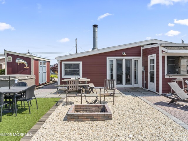 68 Gregg Dr, Beach Haven West, NJ 08050 - back of property featuring a patio, an outdoor fire pit, outdoor dining area, and french doors