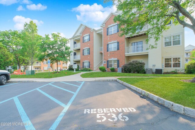 511 Coppola Dr, South Plainfield, NJ 07080 - view of building exterior featuring uncovered parking and cooling unit