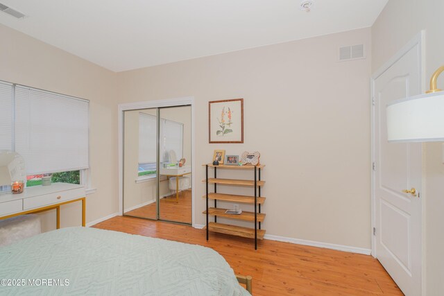 511 Coppola Dr, South Plainfield, NJ 07080 - bedroom with light wood finished floors, baseboards, and a closet